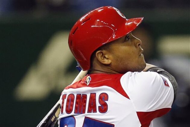 FILE - In this March 9, 2013, file photo, Cuba's Yasmany Tomas hits a three-run home run off Taiwan pitcher Yang Yao-hsun in the fourth inning of their World Baseball Classic second-round game in Tokyo. Tomas can become a free agent again after receiving $36 million during the first four years of his contract with the Arizona Diamondbacks. Under the agreement announced Monday, Dec. 8, 2014, the Cuban defector is guaranteed $68.5 million over six seasons.  (AP Photo/Koji Sasahara, File)