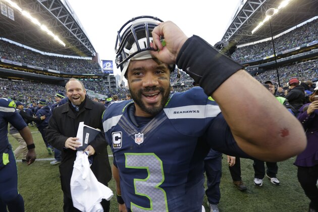 Seattle Seahawks quarterback Russell Wilson (3) celebrates after an NFL football NFC Championship game against the Green Bay Packers Sunday, Jan. 18, 2015, in Seattle. The Seahawks won 28-22 to advance to Super Bowl XLIX. (AP Photo/Ted S. Warren)