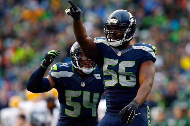 SEATTLE, WA - JANUARY 18:  Cliff Avril #56 and Bobby Wagner #54 of the Seattle Seahawks react during the third quarter of the 2015 NFC Championship game against the Green Bay Packers at CenturyLink Field on January 18, 2015 in Seattle, Washington.  (Photo by Tom Pennington/Getty Images)