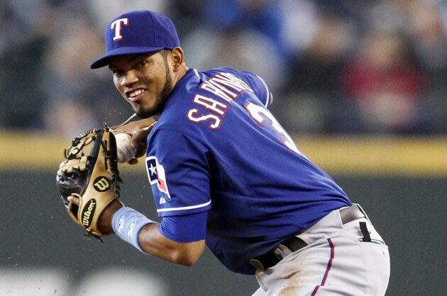 Jun 15, 2014; Seattle, WA, USA; Texas Rangers second baseman Luis Sardinas (3) assists on a putout against the Seattle Mariners during the fourth inning at Safeco Field. Mandatory Credit: Joe Nicholson-USA TODAY Sports