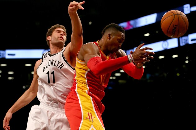 NEW YORK, NY - JANUARY 12: Dwight Howard #12 of the Houston Rockets and Brook Lopez #11 of the Brooklyn Nets fight for the rebound at the Barclays Center on January 12, 2015 in the Brooklyn borough of New York City.The Houston Rockets defeated the Brooklyn Nets 113-99. NOTE TO USER: User expressly acknowledges and agrees that, by downloading and/or using this photograph, user is consenting to the terms and conditions of the Getty Images License Agreement. (Photo by Elsa/Getty Images) NEW YORK, NY - JANUARY 12: Dwight Howard #12 of the Houston Rockets and Brook Lopez #11 of the Brooklyn Nets fight for the rebound at the Barclays Center on January 12, 2015 in the Brooklyn borough of New York City.The Houston Rockets defeated the Brooklyn Nets 113-99. NOTE TO USER: User expressly acknowledges and agrees that, by downloading and/or using this photograph, user is consenting to the terms and conditions of the Getty Images License Agreement. (Photo by Elsa/Getty Images)