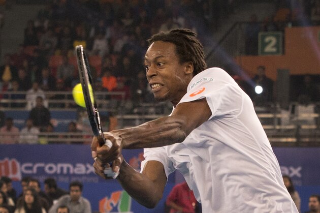 Micromax Indian Aces player Gael Monfils, plays against Manila Mavericks player Jo-Wilfried Tsonga  in men's singles during International Premier Tennis League, in New Delhi, India ,Saturday, Dec. 6, 2014. (AP Photo /Manish Swarup)
