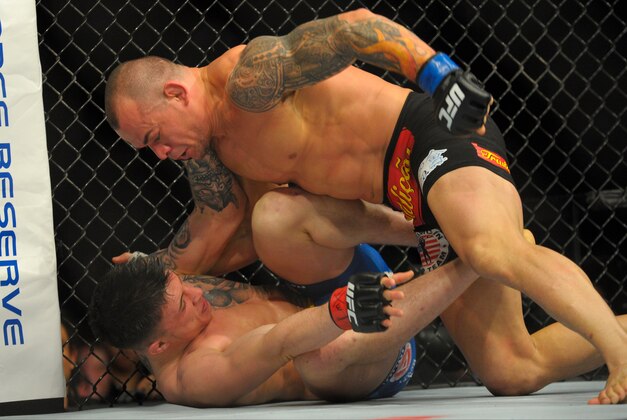 Jan 18, 2015; Boston, MA, USA; Norman Parke (red) and Gleison Tibau (blue) compete during a lightweight bout at UFC Fight Night at TD Garden. Mandatory Credit: Bob DeChiara-USA TODAY Sports