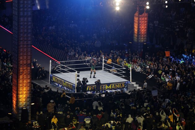 Ryan Reeves, known as Ryback, lifts Mark Henry during their match at the WWE Wrestlemania 29 wrestling event, Sunday, April 7, 2013, in East Rutherford, N.J. (AP Photo/Mel Evans)