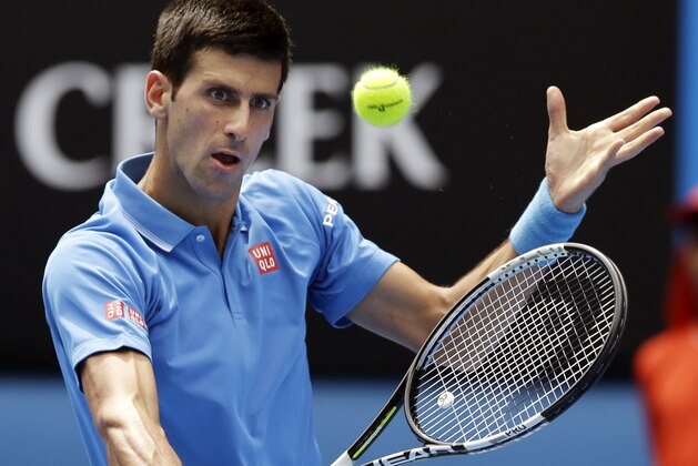 Novak Djokovic of Serbia makes backhand return to Slovenia’s Aljaz Bedene during their first round match at the Australian Open tennis championship in Melbourne, Australia, Tuesday, Jan. 20, 2015. (AP Photo/Lee Jin-man) Novak Djokovic of Serbia makes backhand return to Slovenia’s Aljaz Bedene during their first round match at the Australian Open tennis championship in Melbourne, Australia, Tuesday, Jan. 20, 2015. (AP Photo/Lee Jin-man)