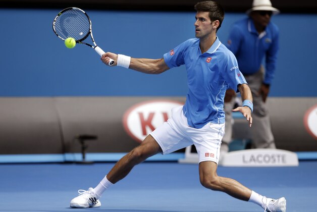 Novak Djokovic of Serbia makes a forehand return to Slovenia’s Aljaz Bedene during their first round match at the Australian Open tennis championship in Melbourne, Australia, Tuesday, Jan. 20, 2015. (AP Photo/Lee Jin-man)