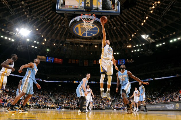 OAKLAND, CA - JANUARY 19: Stephen Curry #30 of the Golden State Warriors shoots a layup against the Denver Nuggets on January 19, 2015 at Oracle Arena in Oakland, California. NOTE TO USER: User expressly acknowledges and agrees that, by downloading and or using this photograph, user is consenting to the terms and conditions of Getty Images License Agreement. Mandatory Copyright Notice: Copyright 2015 NBAE (Photo by Noah Graham/NBAE via Getty Images)