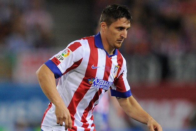 MADRID, SPAIN - AUGUST 22:  Cristian Rodriguez of Club Atletico d Madrid in action during the Supercopa, second leg match between Club Atletico de Madrid and Real Madrid at Vicente Caldron stadium on August 22, 2014 in Madrid, Spain.  (Photo by Denis Doyle/Getty Images)