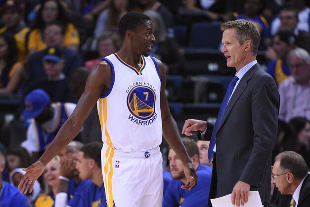 October 21, 2014; Oakland, CA, USA; Golden State Warriors head coach Steve Kerr (right) instructs guard Justin Holiday (7) during the second quarter against the Los Angeles Clippers at Oracle Arena. Mandatory Credit: Kyle Terada-USA TODAY Sports