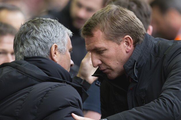 Liverpool's manager Brendan Rodgers, right, greets Chelsea's manager Jose Mourinho before the English Premier League soccer match between Liverpool and Chelsea at Anfield Stadium, Liverpool, England, Saturday Nov. 8, 2014. (AP Photo/Jon Super)