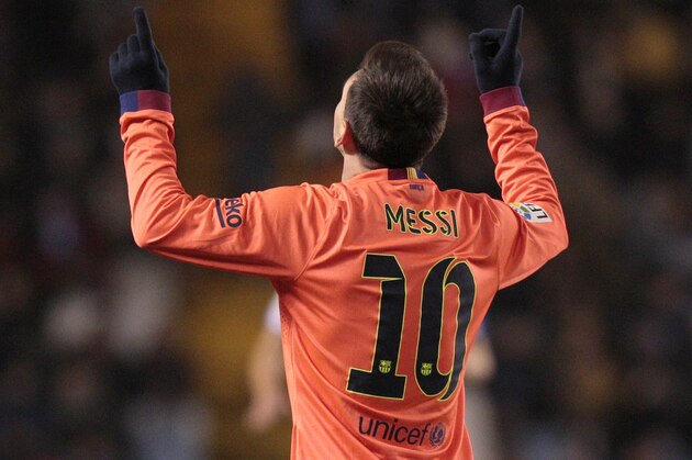 Barcelona's Lionel Messi, from Argentina, celebrates after scoring against Deportivo during a Spanish La Liga soccer match at the Riazor stadium in A Coruna, Spain, Sunday, Jan. 17, 2015. (AP Photo/Lalo R. Villar)