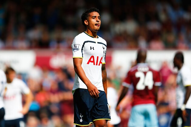 LONDON, ENGLAND - AUGUST 16:  A dejected Kyle Naughton of Spurs walks off the pitch after receiving the red card forhandball during the Barclays Premier League match between West Ham United and Tottenham Hotspur at Boleyn Ground on August 16, 2014 in London, England.  (Photo by Julian Finney/Getty Images)