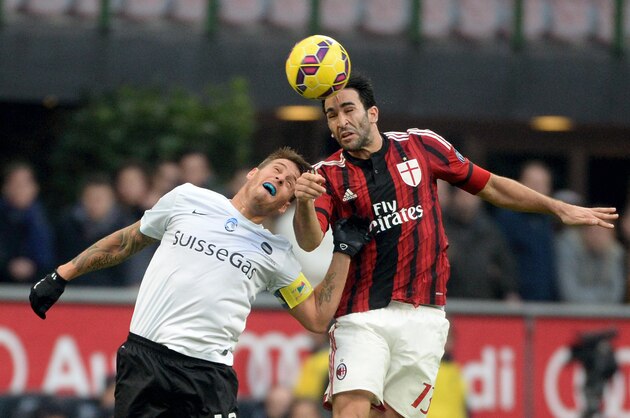 MILAN, ITALY - JANUARY 18:  (L-R) Gustavo German Denis of Atalanta BC competes for the ball with Adil Rami of AC Milan in action during  the Serie A match between AC Milan and Atalanta BC at Stadio Giuseppe Meazza on January 18, 2015 in Milan, Italy.  (Photo by Pier Marco Tacca/Getty Images)