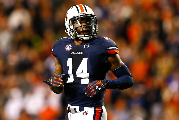 AUBURN, AL - NOVEMBER 08:  Nick Marshall #14 of the Auburn Tigers walks off the field after fumbling to the Texas A&M Aggies on the two-yard line in just under the last three minutes of their 41-38 loss at Jordan Hare Stadium on November 8, 2014 in Auburn, Alabama.  (Photo by Kevin C. Cox/Getty Images)