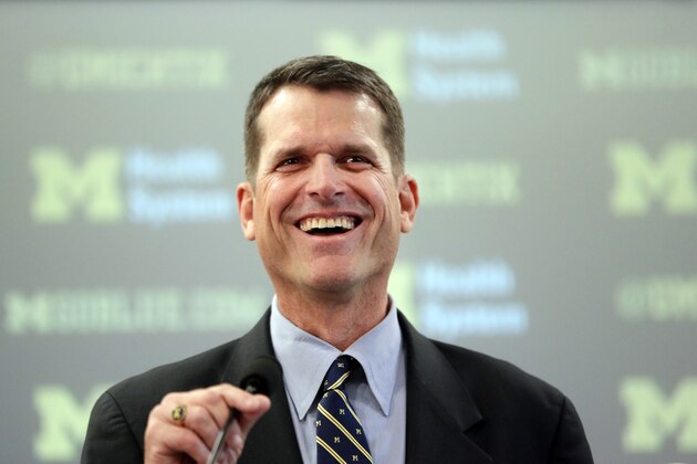 Jim Harbaugh, Michigan's new head football coach, addresses the media after after he was introduced during an NCAA college football news conference Tuesday, Dec. 30, 2014, in Ann Arbor, Mich. (AP Photo/Carlos Osorio)