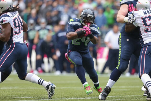 SEATTLE, WA - OCTOBER 14:  Running back Marshawn Lynch #24 of the Seattle Seahawks rushes against the New England Patriots at CenturyLink Field on October 14, 2012 in Seattle, Washington.  (Photo by Otto Greule Jr/Getty Images)
