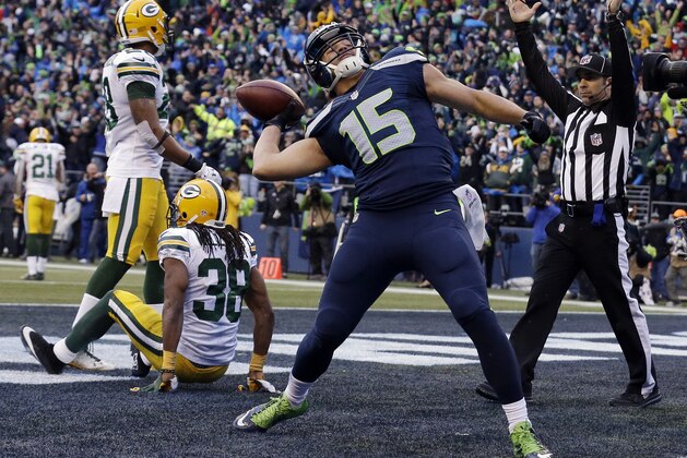 Seattle Seahawks' Jermaine Kearse celebrates after catching the game-winning touchdown during overtime of the NFL football NFC Championship game against the Green Bay Packers Sunday, Jan. 18, 2015, in Seattle. The Seahawks won 28-22 to advance to Super Bowl XLIX. (AP Photo/Jeff Chiu)