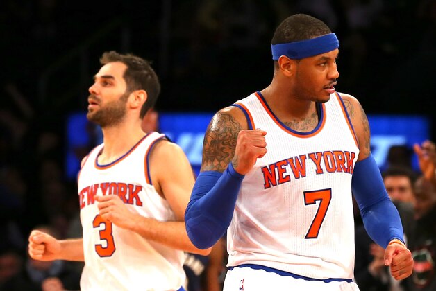 Jan 19, 2015; New York, NY, USA; New York Knicks forward Carmelo Anthony (7) reacts after guard Jose Calderon (3) made a three-point shot against the New Orleans Pelicans late in the fourth quarter at Madison Square Garden. The Knicks defeated the Pelicans 99-92. Mandatory Credit: Adam Hunger-USA TODAY Sports