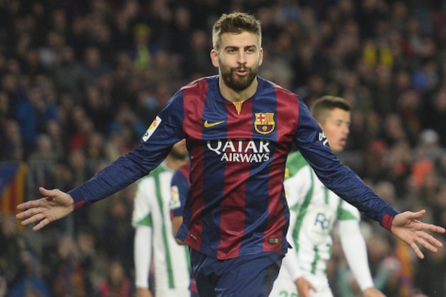 FC Barcelona's Gerard Pique reacts after scoring against Cordoba during a Spanish La Liga soccer match at the Camp Nou stadium in Barcelona, Spain, Saturday, Dec. 20, 2014. (AP Photo/Manu Fernandez)