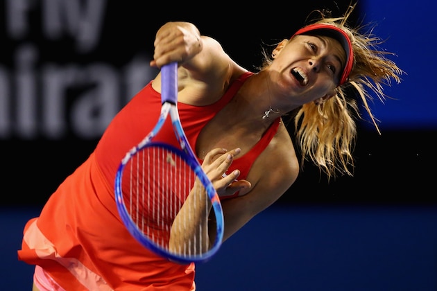 MELBOURNE, AUSTRALIA - JANUARY 19:  Maria Sharapova of Russia serves in her first round match against Petra Martic of Croatia during day one of the 2015 Australian Open at Melbourne Park on January 19, 2015 in Melbourne, Australia.  (Photo by Clive Brunskill/Getty Images)