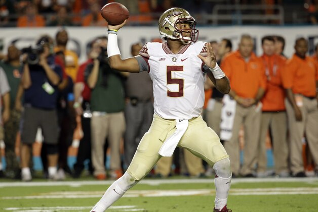 Florida State quarterback Jameis Winston (5) stands back to pass in the first half an NCAA college football game against Miami, Saturday, Nov. 15, 2014, in Miami Gardens, Fla. (AP Photo/Lynne Sladky)