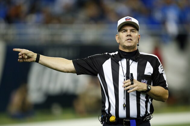 NFL Referee Bill Vinovich makes a call during an NFL football game between the Detroit Lions and the Chicago Bears on Thursday, Nov. 27, 2014 in Detroit. The Lions won the game 34-17. (Jeff Haynes/AP Images for Panini)