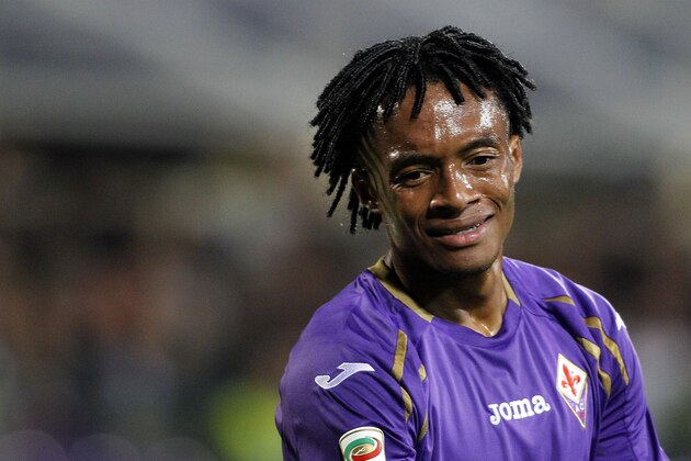 Fiorentina's Juan Cuadrado looks down during a Serie A soccer match between Fiorentina and Sassuolo at the Artemio Franchi stadium in Florence, Italy, Wednesday, Sept. 24, 2014. (AP Photo/Fabrizio Giovannozzi)