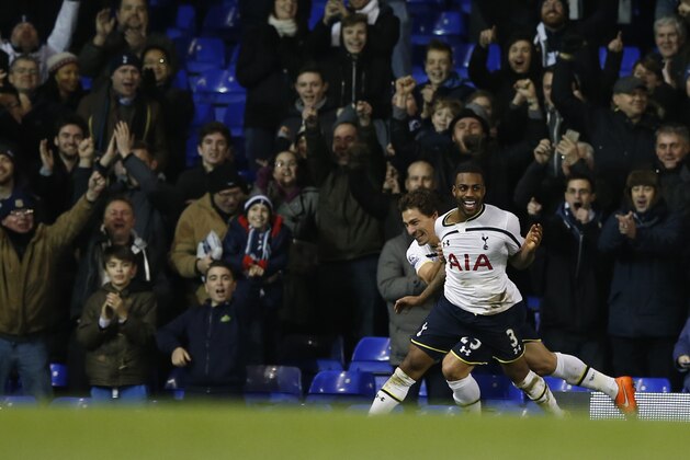 Tottenham’s Danny Rose, no 3, celebrates after scoring his sides fourth goal during the English FA Cup third round replay soccer match between Tottenham Hotspur and Burnley at the White Hart Lane stadium in London, Wednesday, Jan. 14, 2015. (AP Photo/Alastair Grant)