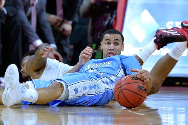 RALEIGH, NC - JANUARY 14:  Marcus Paige #5 of the North Carolina Tar Heels battles Trevor Lacey #1 of the North Carolina State Wolfpack for a loose ball during their game at PNC Arena on January 14, 2015 in Raleigh, North Carolina. North Carolina won 81-79.  (Photo by Grant Halverson/Getty Images)
