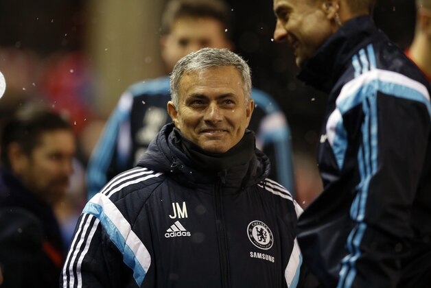 Chelsea's head coach Jose Mourinho smiles before the English League Cup semi-final first leg soccer match between Liverpool and Chelsea at Anfield Stadium, Liverpool, England, Tuesday Jan. 20, 2015. (AP Photo/Jon Super)