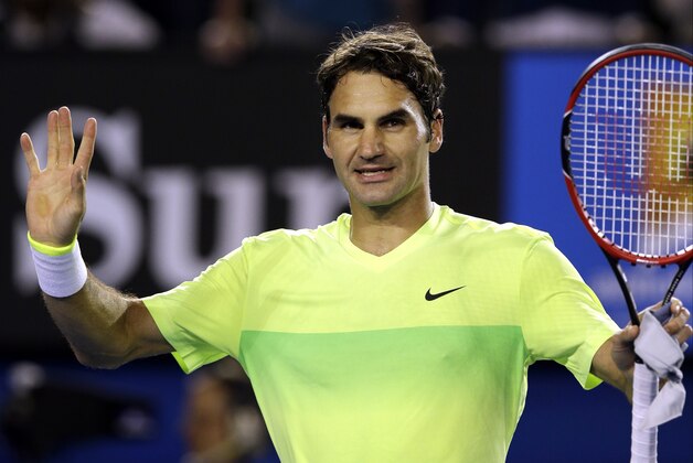 Roger Federer of Switzerland celebrates after beating Lu Yen-Hsun of Taiwan during their first round match at the Australian Open tennis championship in Melbourne, Australia, Monday, Jan. 19, 2015. (AP Photo/Bernat Armangue)