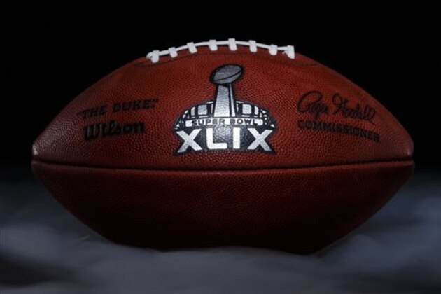 An official game ball for the NFL football Super Bowl XLIX is photographed, Tuesday, Jan. 20, 2015, at the Wilson Sporting Goods football factory in Ada, Ohio. The company, which has made the official Super Bowl football since the first Super Bowl in 1966, began making the this year's game balls last Sunday night, Jan. 18, immediately after the conclusion of the NFC and AFC championship games. The New England Patriots take on the Seattle Seahawks in the NFL championship on Sunday, Feb. 1, in Glendale, Ariz. (AP Photo/Rick Osentoski)