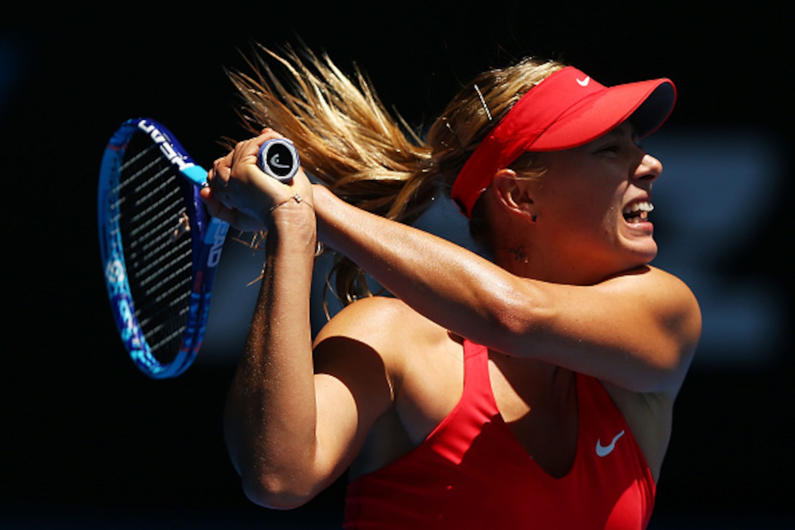 MELBOURNE, AUSTRALIA - JANUARY 21:  Maria Sharapova of Russia plays a shot in her second round match against Alexandra Panova of Russia during day three of the 2015 Australian Open at Melbourne Park on January 21, 2015 in Melbourne, Australia.  (Photo by Ryan Pierse/Getty Images)