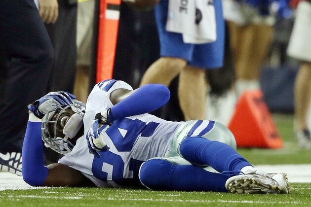 FILE - In this Sept. 8, 2013 file photo, the Dallas Cowboys' Morris Claiborne (24) lays on the ground with a dislocated shoulder after tackling the New York Giants' Brandon Myers (83) in the third quarter of an NFL football game in Arlington, Texas. Claiborne, already playing with a dinged shoulder, now has wounded pride after a pass interference penalty that cost the Cowboys a chance to come back. (AP Photo/Tony Gutierrez, File)