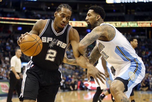 Jan 20, 2015; Denver, CO, USA; San Antonio Spurs forward Kawhi Leonard (2) drives to the basket against Denver Nuggets forward Wilson Chandler (21) during the first half at Pepsi Center. Mandatory Credit: Chris Humphreys-USA TODAY Sports