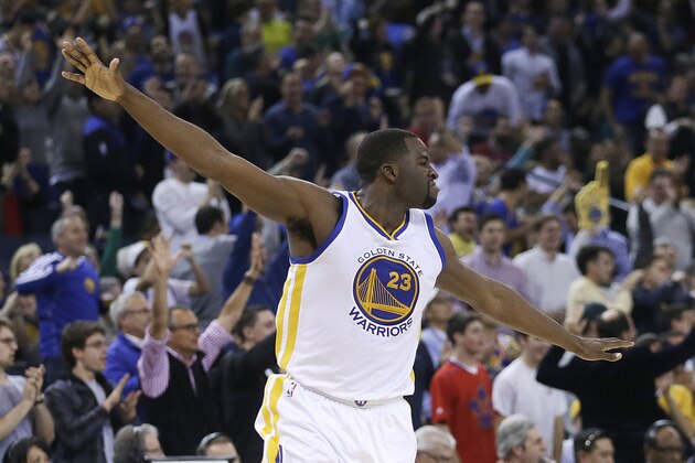 Golden State Warriors' Draymond Green celebrates after scoring against the Cleveland Cavaliers during the second half of an NBA basketball game Friday, Jan. 9, 2015, in Oakland, Calif. (AP Photo/Ben Margot)