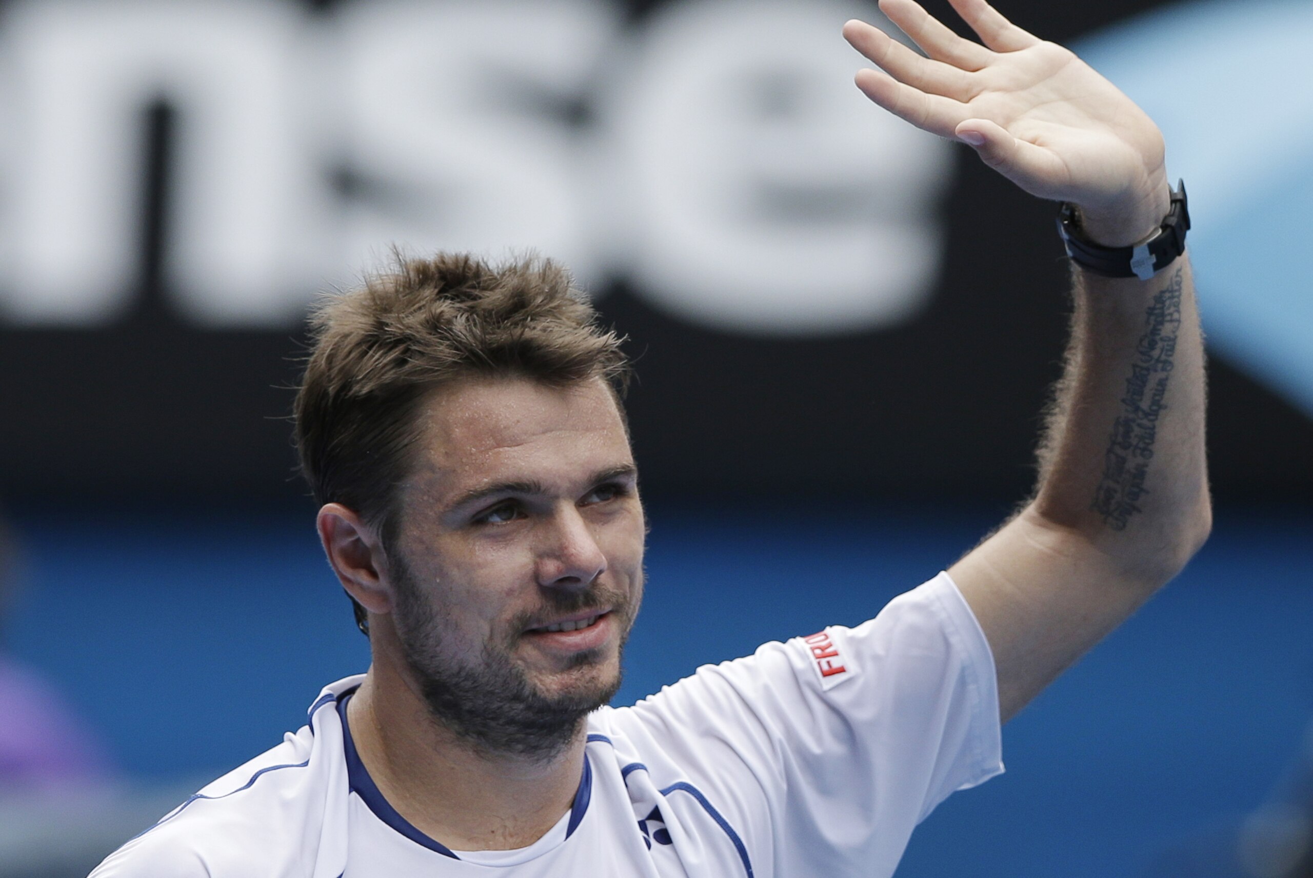 Stan Wawrinka of Switzerland celebrates after beating Turkey’s Marsel Ilhan during their first round match at the Australian Open tennis championship in Melbourne, Australia, Tuesday, Jan. 20, 2015. (AP Photo/Lee Jin-man)