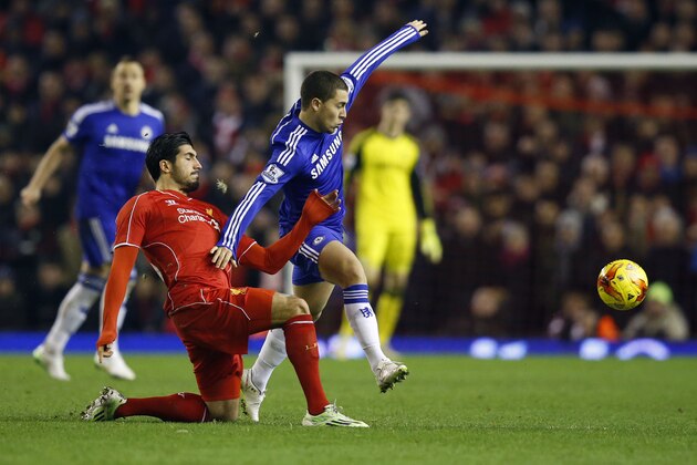 Chelsea's Eden Hazard collides with Liverpool's Emre Can, left, during the English League Cup semi-final first leg soccer match between Liverpool and Chelsea at Anfield Stadium, Liverpool, England, Tuesday Jan. 20, 2015. (AP Photo/Jon Super)