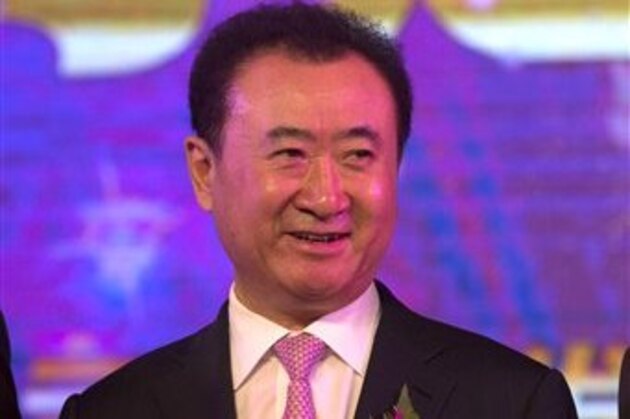 Wanda Chairman Wang Jianlin attends a signing ceremony to mark Dalian Wanda Group's expansion into UK businesses during an event held in Beijing, China, Wednesday, June 19, 2013. Chinese property and cinema conglomerate Dalian Wanda Group says it is buying British yacht maker Sunseeker and will develop an upmarket London hotel, expanding into the luxury market as part of the latest foray abroad by a major Chinese firm. (AP Photo/Ng Han Guan)