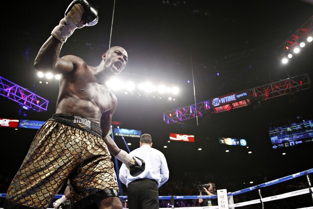 Deontay Wilder celebrates after defeating Bermane Stiverne in their WBC heavyweight title boxing bout Saturday, Jan. 17, 2015, in Las Vegas. (AP Photo/John Locher)