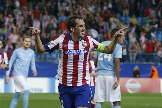 Atletico's Diego Godin celebrates after scoring during the Group A Champions League soccer match between Atletico de Madrid and Malmo at the Vicente Calderon stadium in Madrid, Spain, Wednesday, Oct. 22, 2014. (AP Photo/Andres Kudacki) Atletico's Diego Godin celebrates after scoring during the Group A Champions League soccer match between Atletico de Madrid and Malmo at the Vicente Calderon stadium in Madrid, Spain, Wednesday, Oct. 22, 2014. (AP Photo/Andres Kudacki)