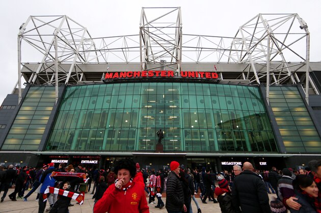 MANCHESTER, ENGLAND - JANUARY 11: Fans arrive at the stadium before the Barclays Premier League match between Manchester United and Southampton at Old Trafford on January 11, 2015 in Manchester, England. (Photo by Clive Mason/Getty Images) MANCHESTER, ENGLAND - JANUARY 11: Fans arrive at the stadium before the Barclays Premier League match between Manchester United and Southampton at Old Trafford on January 11, 2015 in Manchester, England. (Photo by Clive Mason/Getty Images)