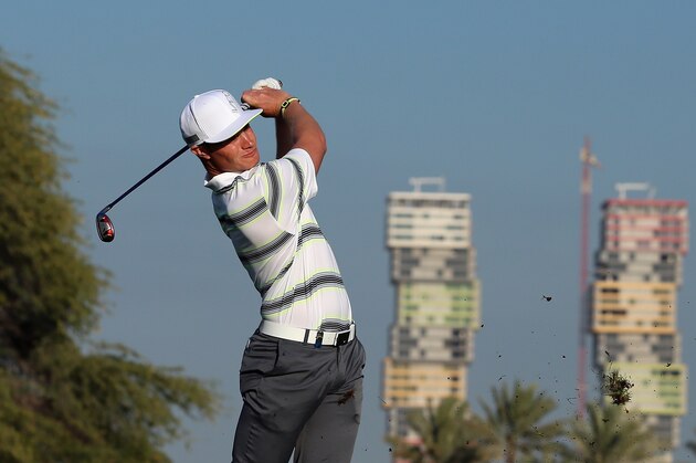 DOHA, QATAR - JANUARY 21:  Oliver Fisher of England plays his second shot on the ninth hole during the first round of the Commercial Bank Qatar Masters at Doha Golf Club on January 21, 2015 in Doha, Qatar.  (Photo by Andrew Redington/Getty Images)