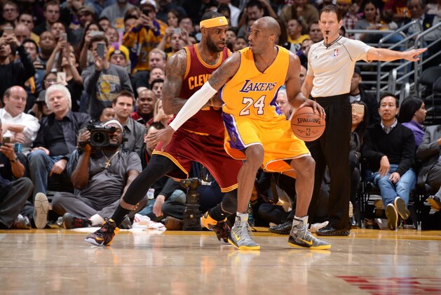 LOS ANGELES, CA - JANUARY 15:  Kobe Bryant #24 of the Los Angeles Lakers handles the ball against LeBron James #23 of the Cleveland Cavaliers on January 15, 2015 at Staples Center in Los Angeles, California. NOTE TO USER: User expressly acknowledges and agrees that, by downloading and or using this Photograph, user is consenting to the terms and conditions of the Getty Images License Agreement. Mandatory Copyright Notice: Copyright 2015 NBAE (Photo by Andrew D. Bernstein/NBAE via Getty Images)