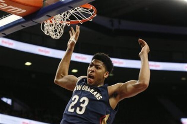 New Orleans Pelicans forward Anthony Davis (23) dunks against the Detroit Pistons in the second half of an NBA basketball game in Auburn Hills, Mich., Wednesday, Jan. 14, 2015. (AP Photo/Paul Sancya)