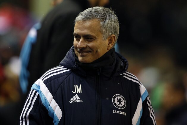 Chelsea's head coach Jose Mourinho smiles before the English League Cup semi-final first leg soccer match between Liverpool and Chelsea at Anfield Stadium, Liverpool, England, Tuesday Jan. 20, 2015. (AP Photo/Jon Super)