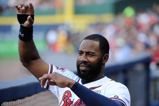 Atlanta Braves right fielder Jason Heyward (22) gestures before the first inning of a baseball game against the Oakland Athletics Friday, Aug. 15, 2014, in Atlanta. (AP Photo/David Tulis)
