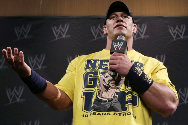 WWE wrestling super star John Cena answers a question during a news conference Sunday, April 7, 2013, in East Rutherford, N.J., ahead of Sunday's WWE Wrestlemania 29. (AP Photo/Mel Evans)