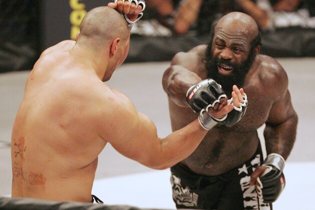 Kimbo Slice, right, throws a punch at James Thompson of Manchester, England during the second round of their EliteXC heavyweight bout at the Prudential Center in Newark, N.J. Saturday, May 31, 2008. Slice won in the third round on a TKO. (AP Photo/Rich Schultz)