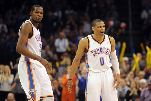 Jan 16, 2015; Oklahoma City, OK, USA;  Oklahoma City Thunder forward Kevin Durant (35) and Oklahoma City Thunder guard Russell Westbrook (0) reacts after a play against the Golden State Warriors during the fourth quarter at Chesapeake Energy Arena. Mandatory Credit: Mark D. Smith-USA TODAY Sports